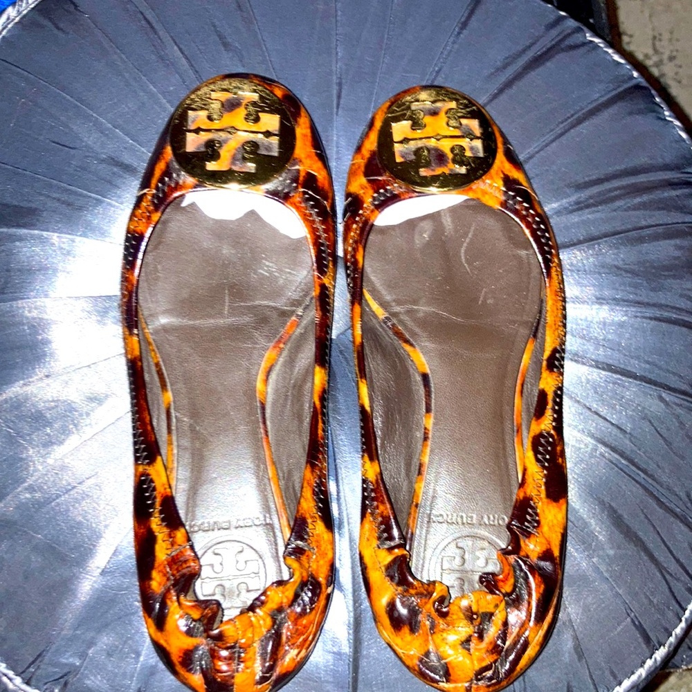 Tory Burch flats. Animal print with gold color logo on toe of shoe